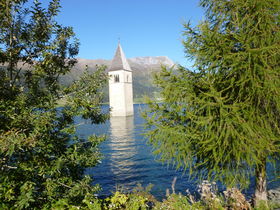 Reschen Lake, the church tower of Graun<br> Reschensee, der Kirchturm von Graun