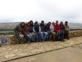 A group of youths by the<br>Virgen de la Concepción Monument