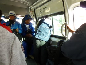 In the Combi between Concepción and Huancayo.<br>Notice the conductor looking out for passengers.